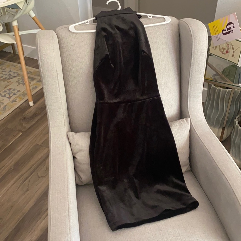Adorable velvet dress with bow detail on the back and high-neck.